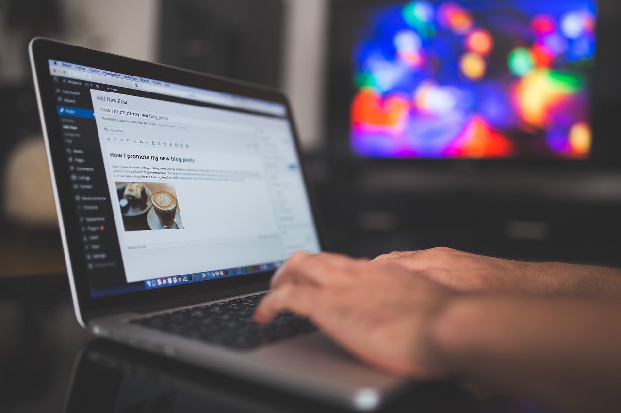 Person updating blog posts to improve their SEO